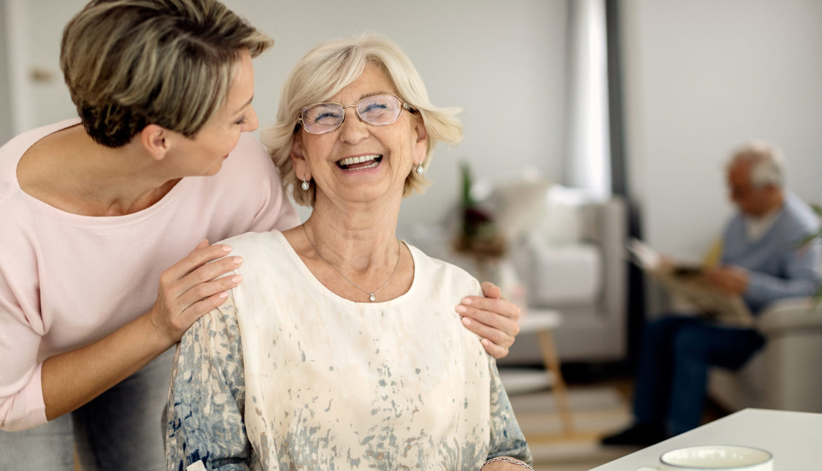 Caregiver sharing a warm moment with a client at home