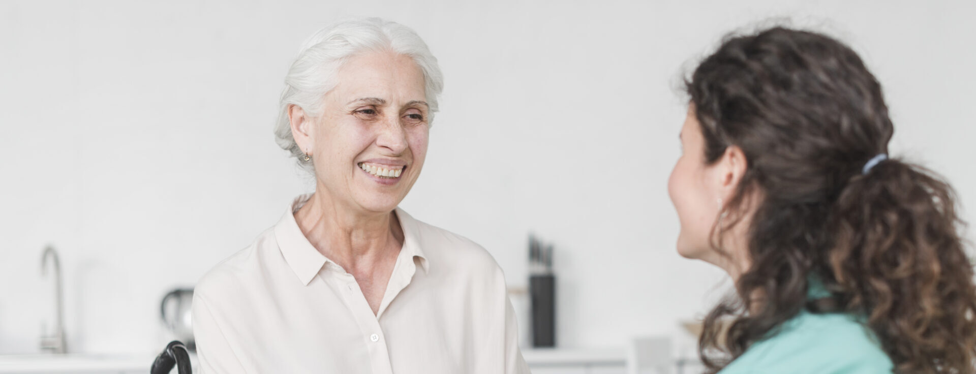 Caregiver helping a senior recover at home.