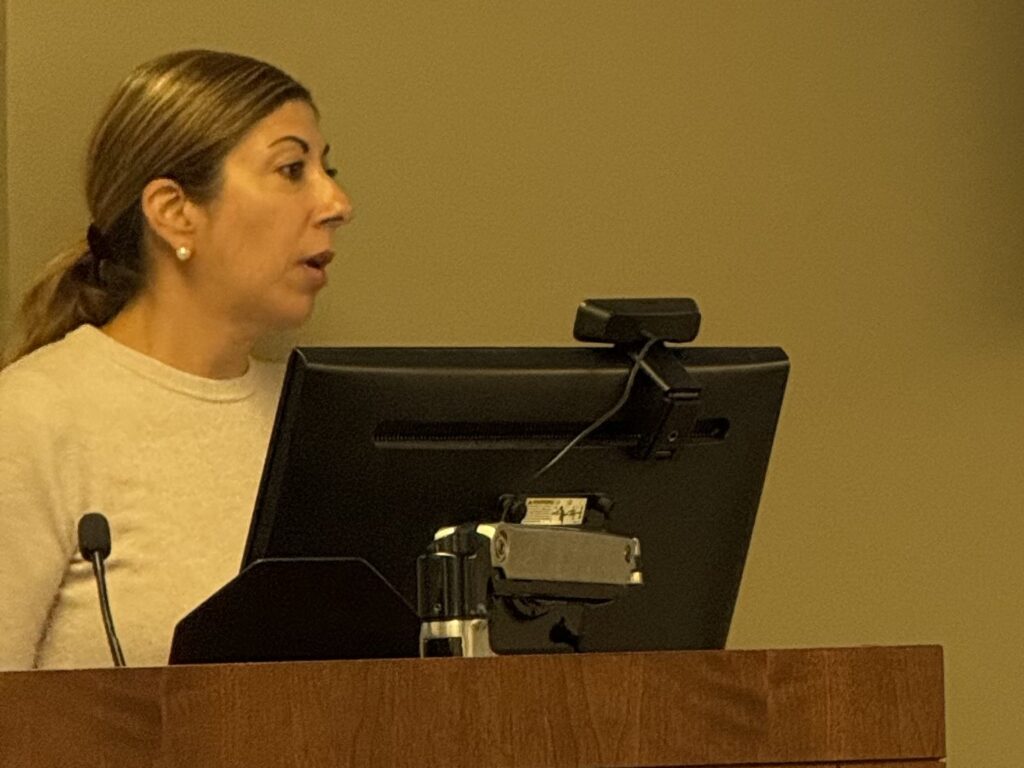 Dr. Jennifer Stelter presenting at the podium